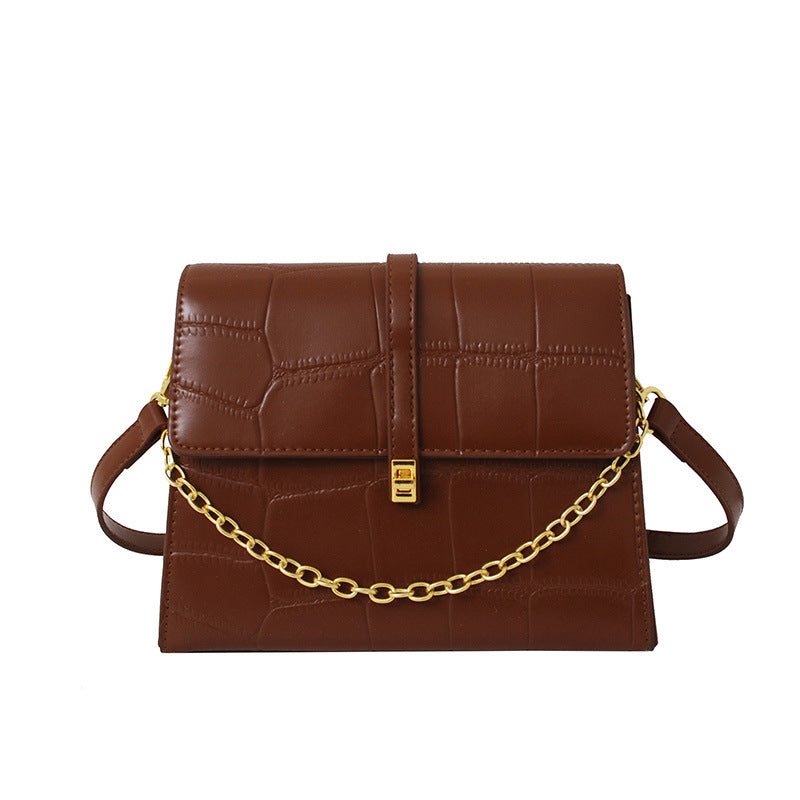 Chain shoulder bag styled with casual outfit