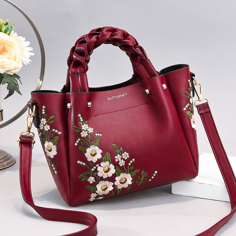 Floral embroidered handbag close up detail